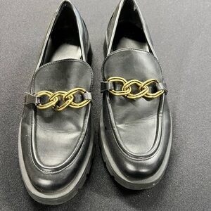 Woman’s Black Loafers with Gold Chain Detail